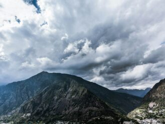 time lapse photography of clouds over mountain